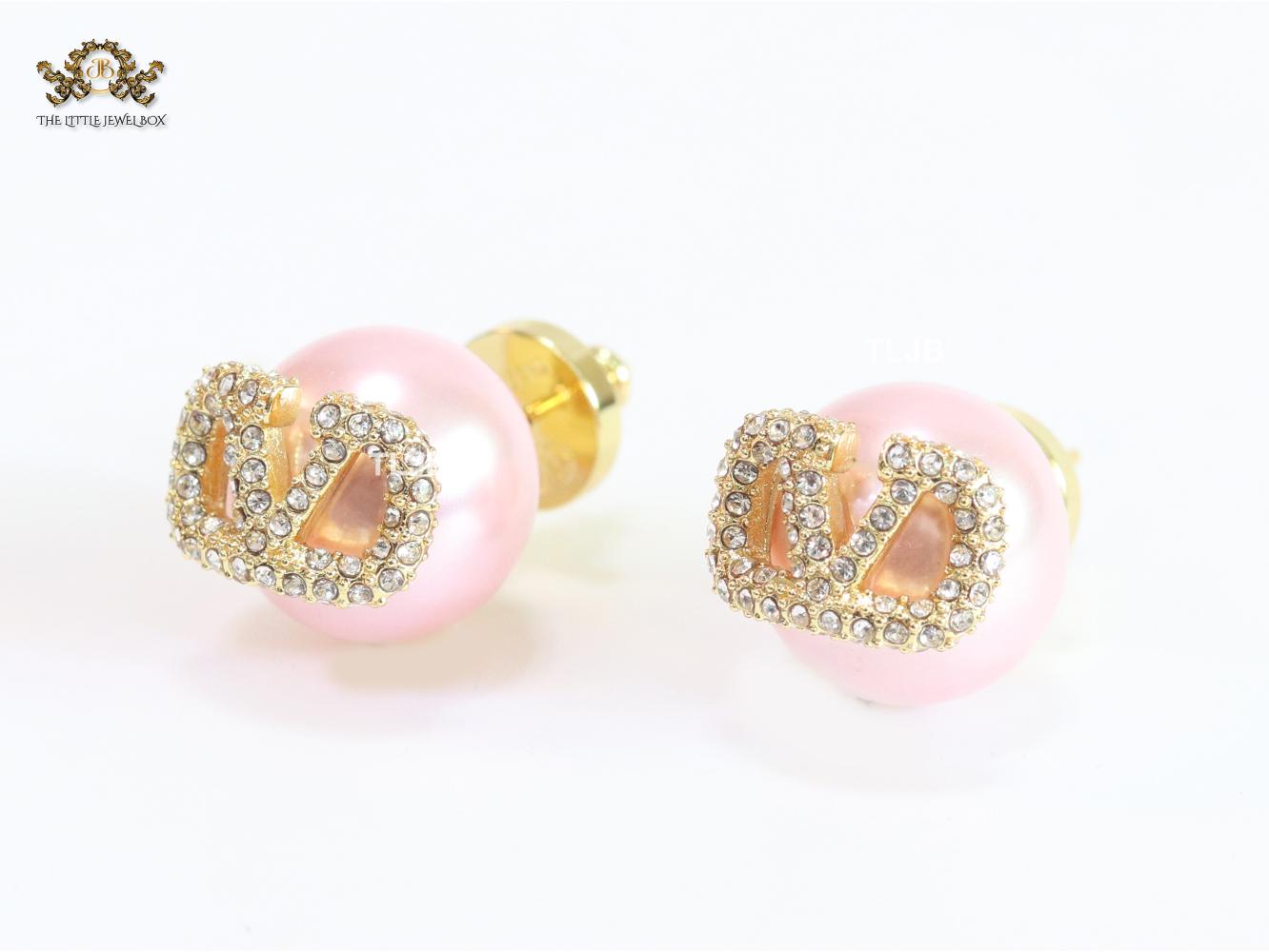 Pink pearl open studs