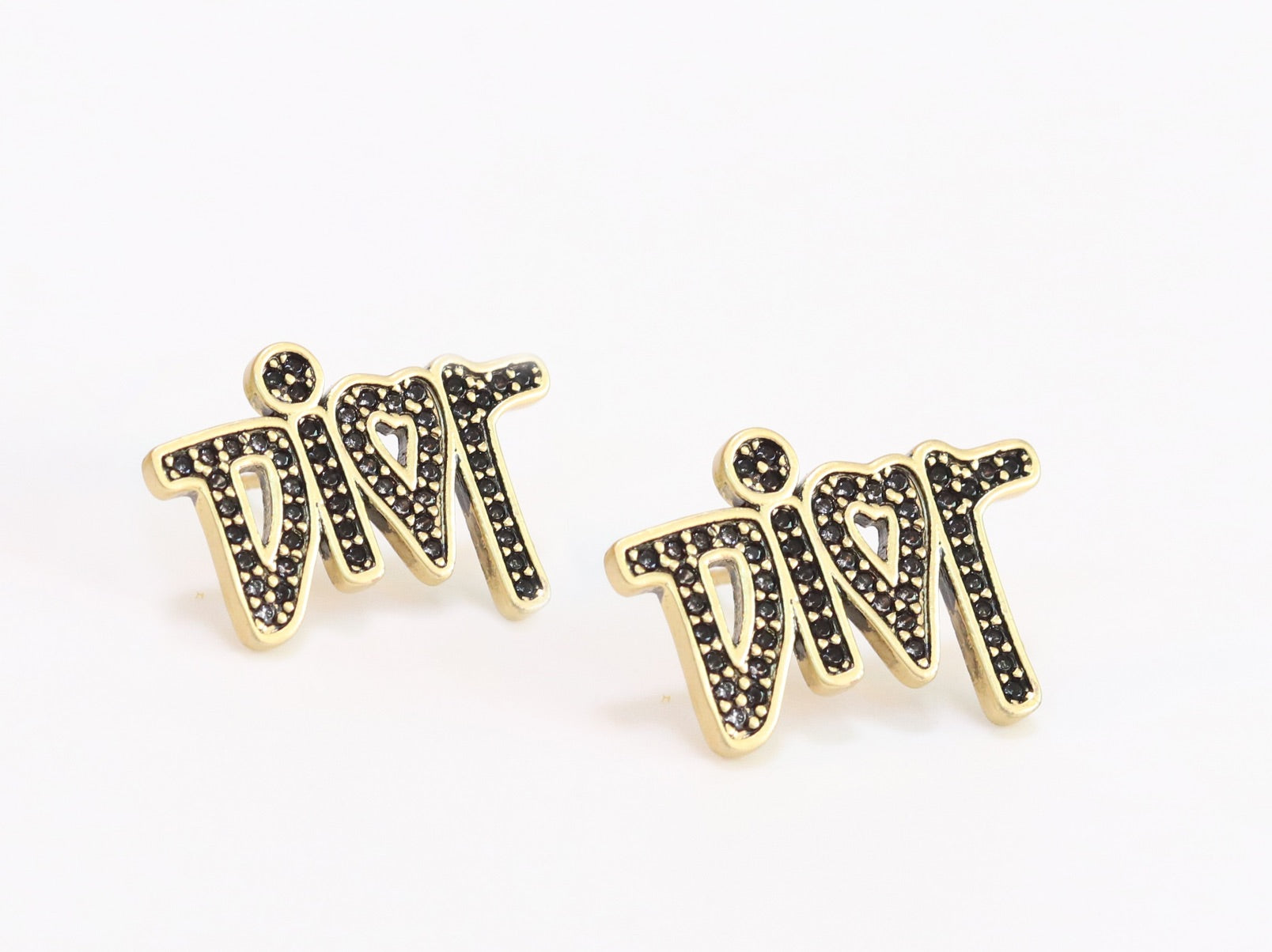Gold Alphabet C and D earrings with black stones
