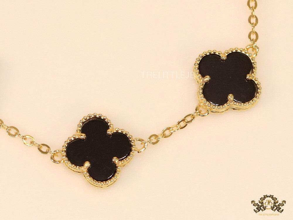 Gold plated chain bracelet with black clover