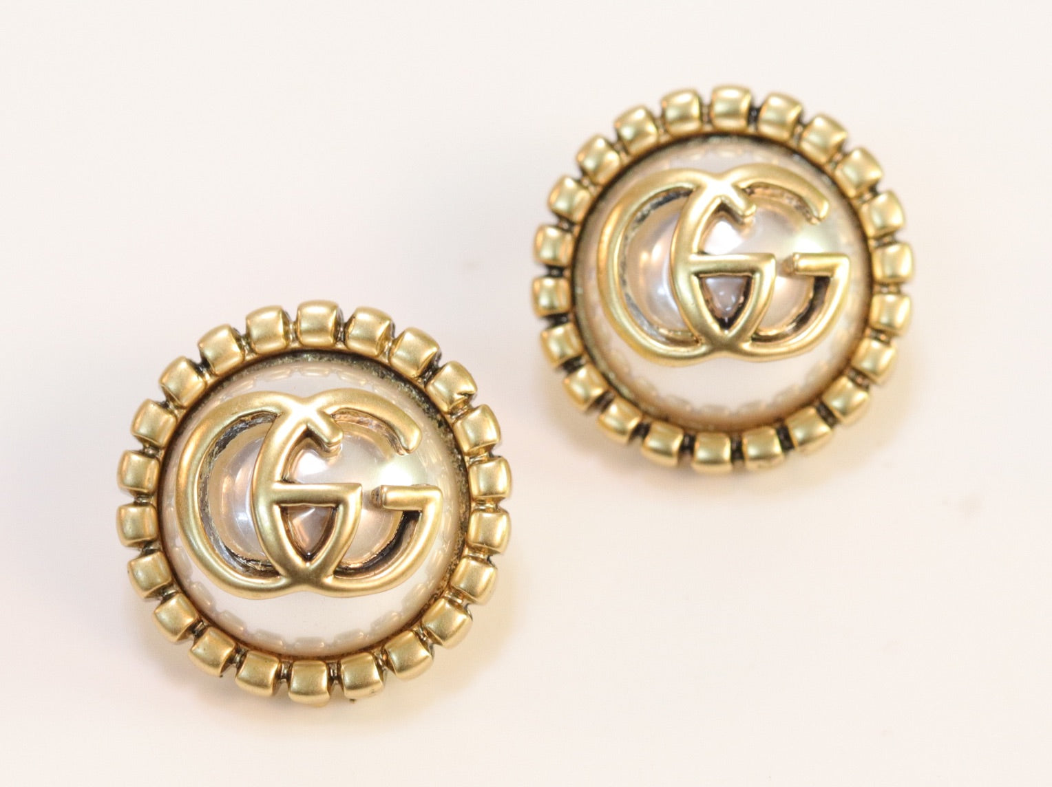 Double G rustic pearl studs
