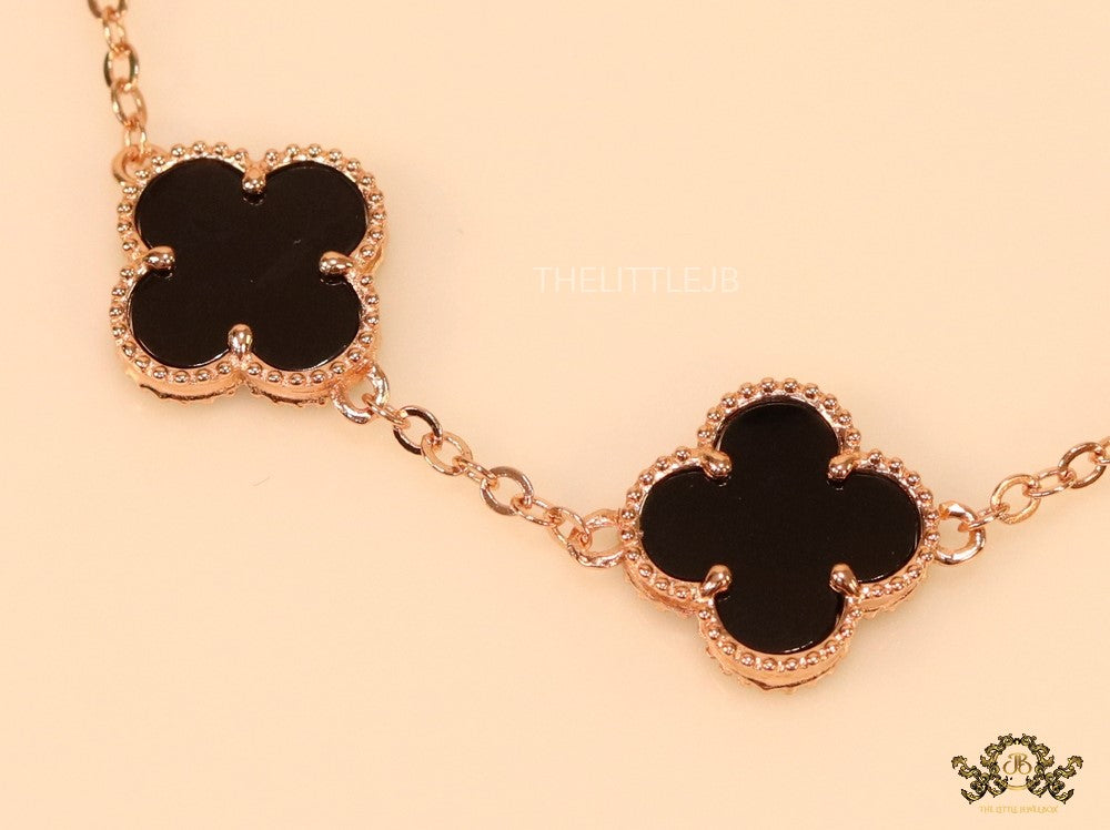 Rose gold plated chain bracelet with black clover