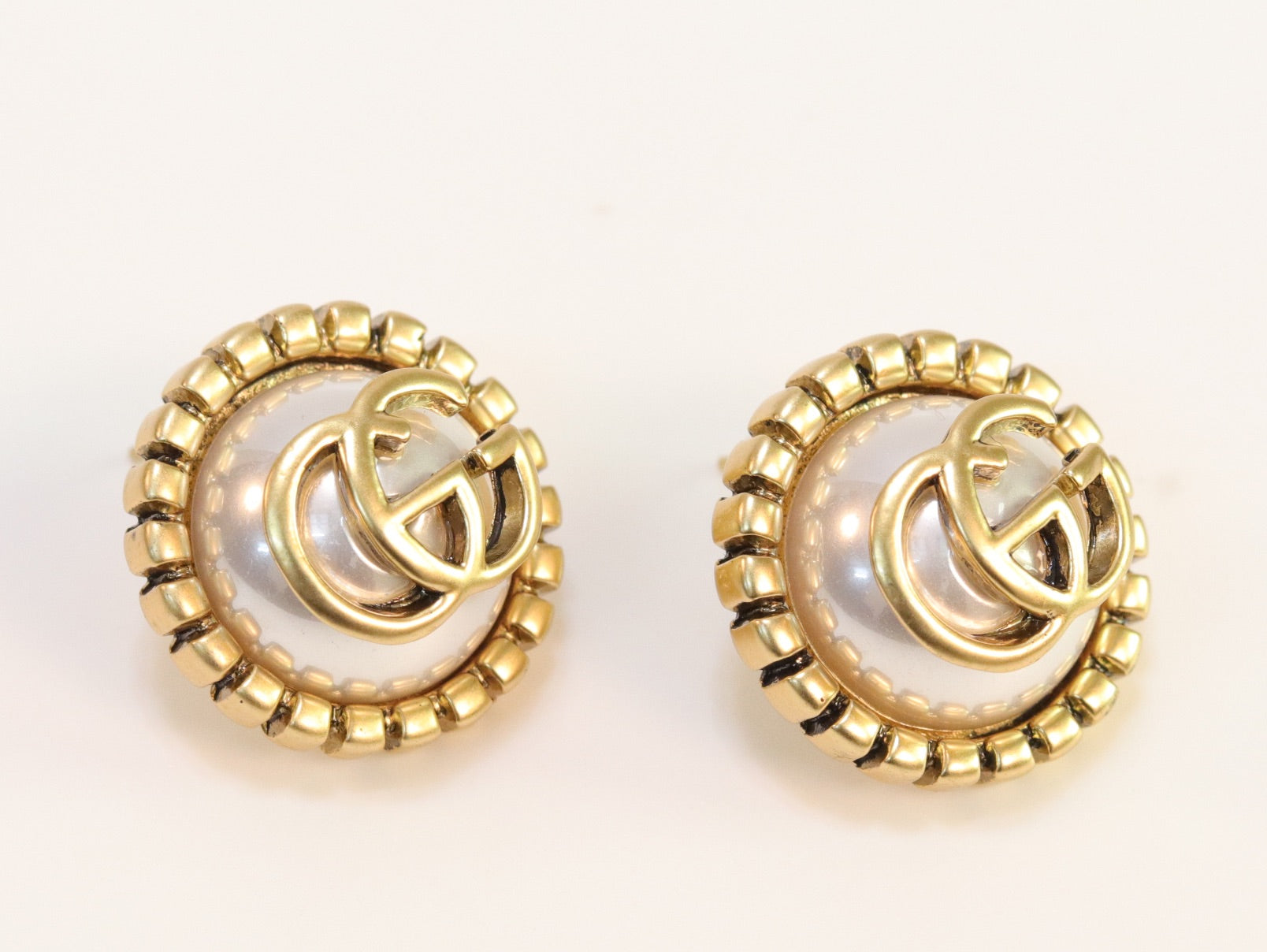 Double G rustic pearl studs