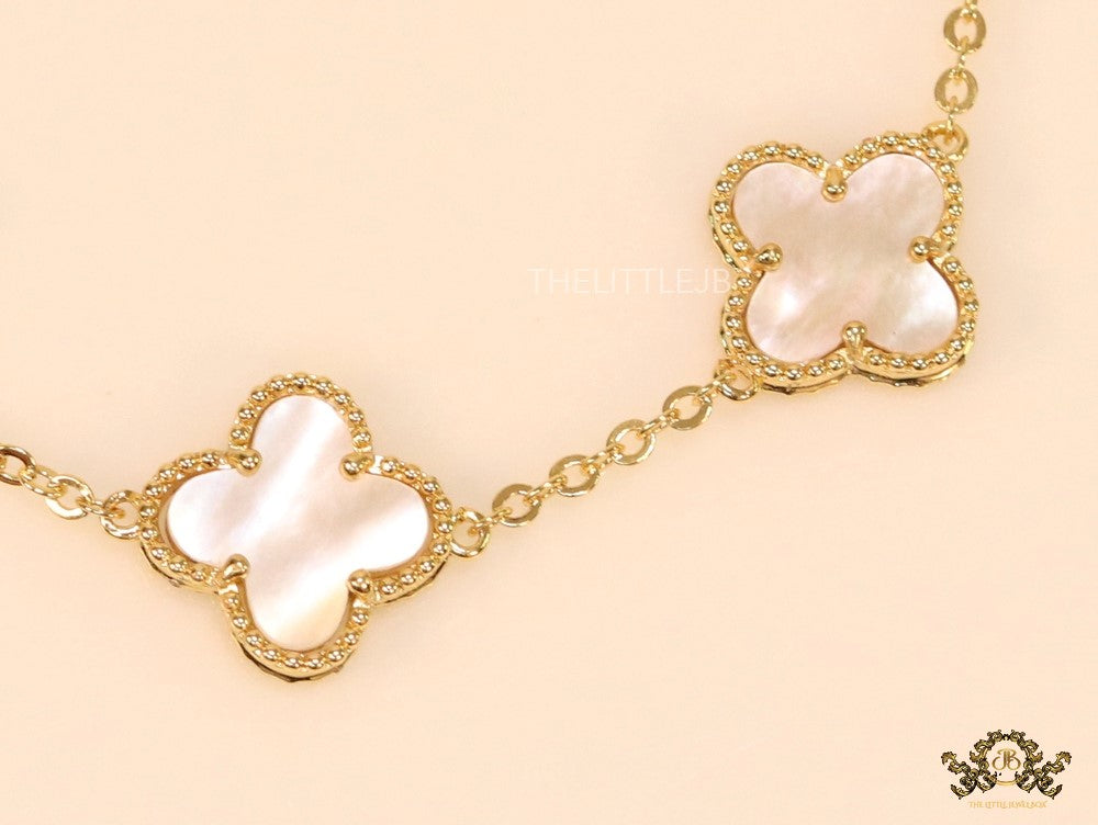 Gold plated chain bracelet with mother of pearl clover