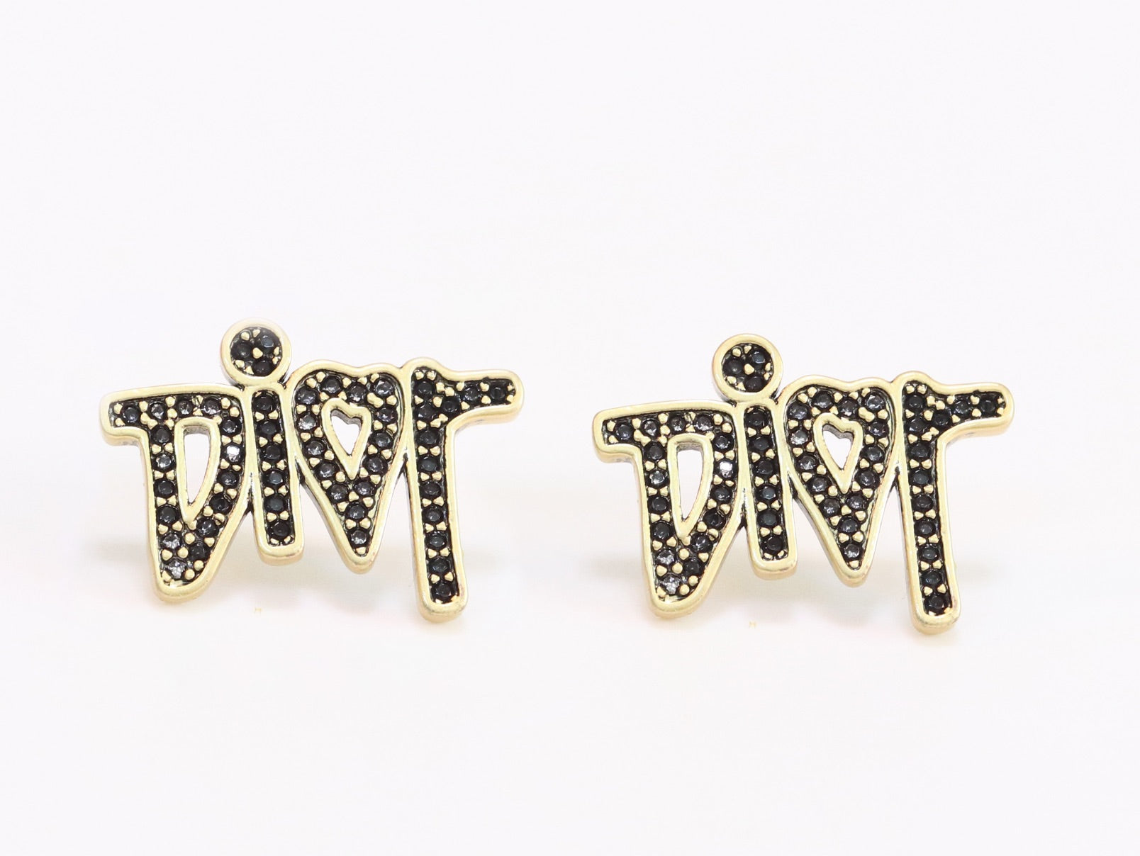 Gold Alphabet C and D earrings with black stones