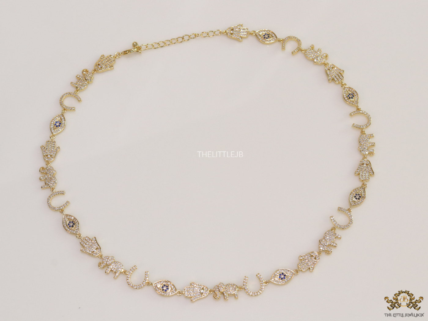 Choker style necklace with charms in gold finish