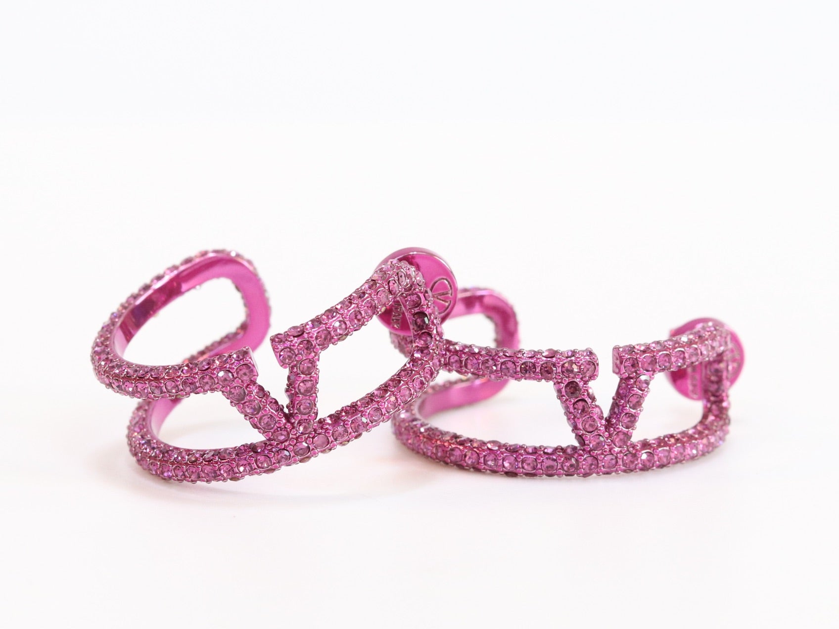 Pink curved open alphabet V hoops