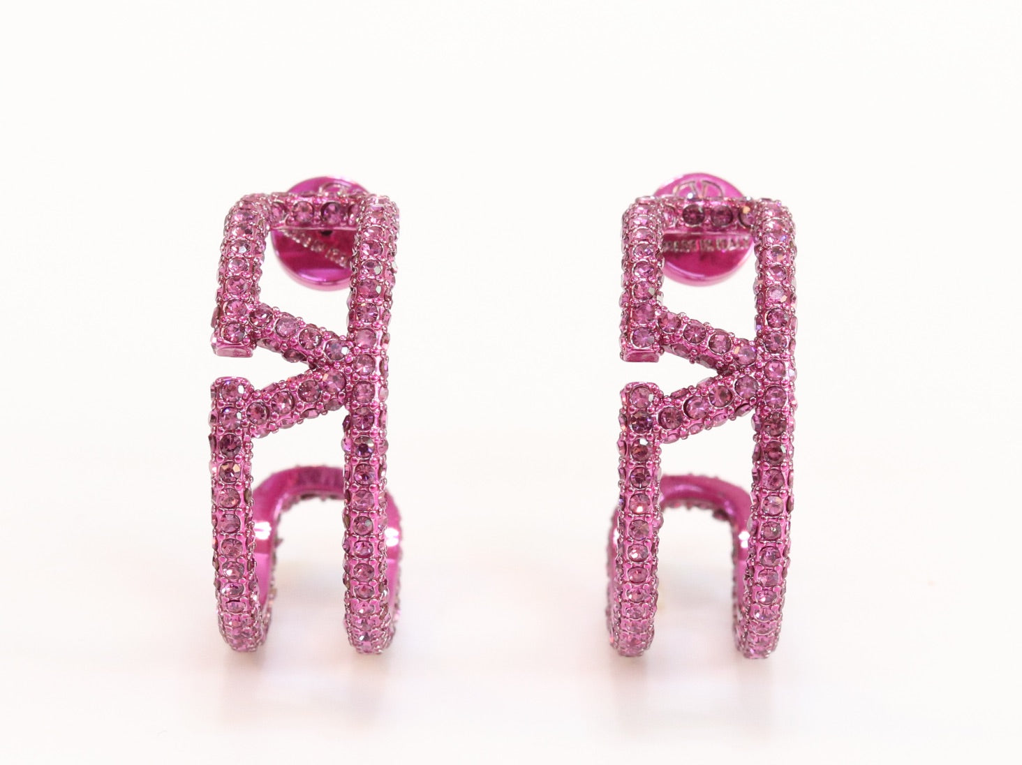 Pink curved open alphabet V hoops