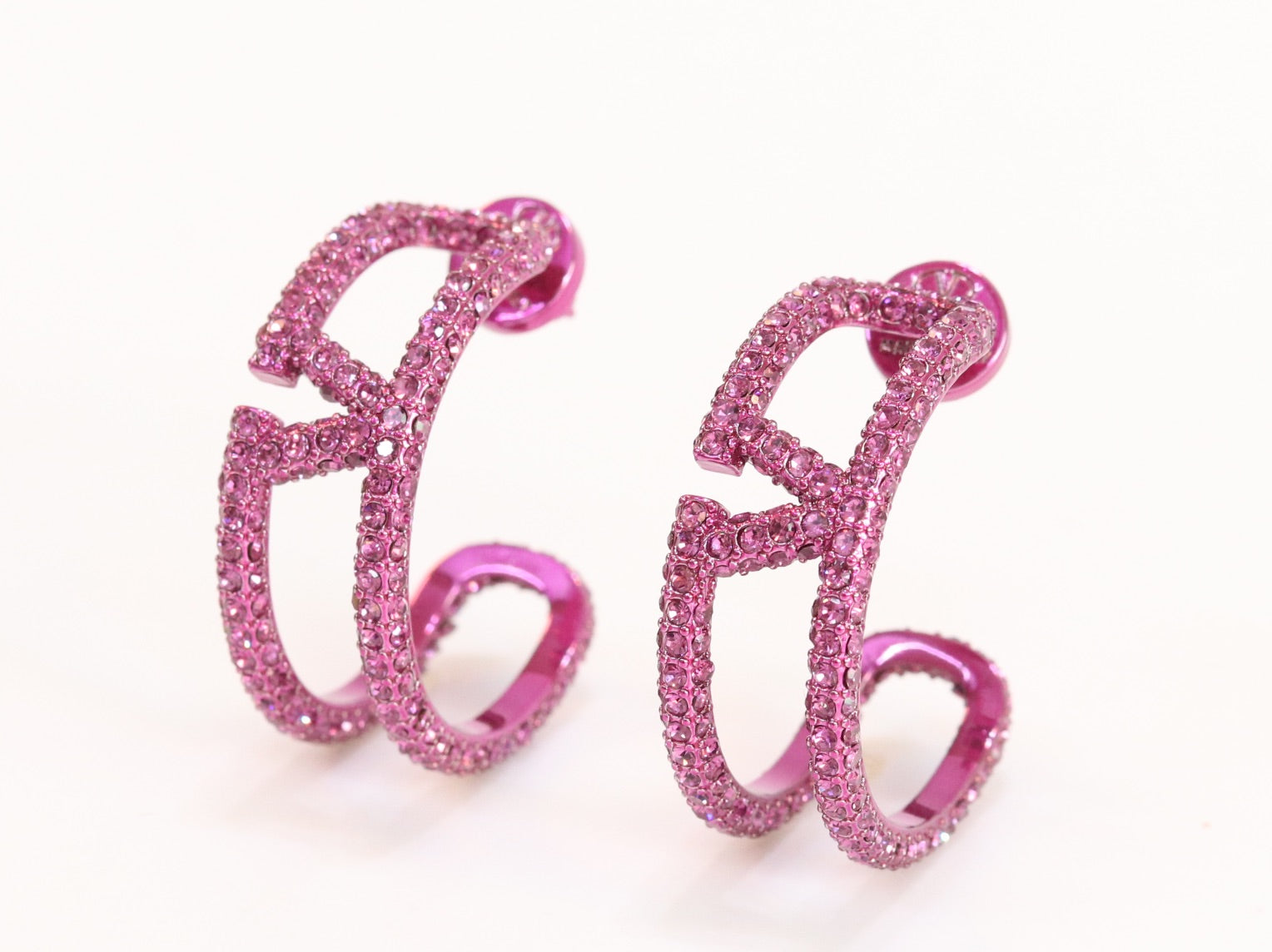 Pink curved open alphabet V hoops
