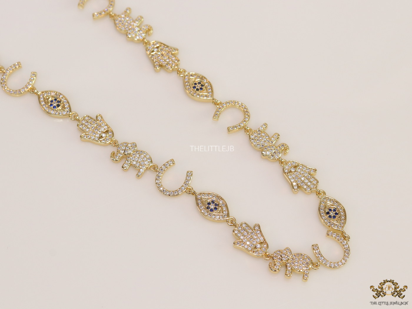 Choker style necklace with charms in gold finish