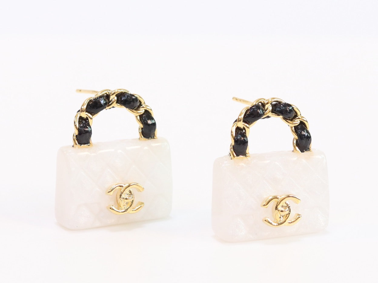 Black and white Double C purse earrings in gold