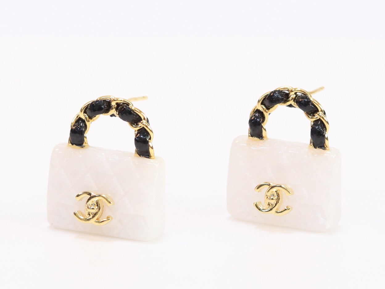 Black and white Double C purse earrings in gold