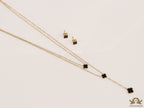 Dual chain necklace with black onyx clovers in gold finish