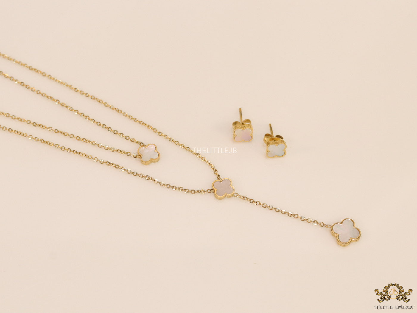 Dual chain necklace with white MOP clover in gold finish
