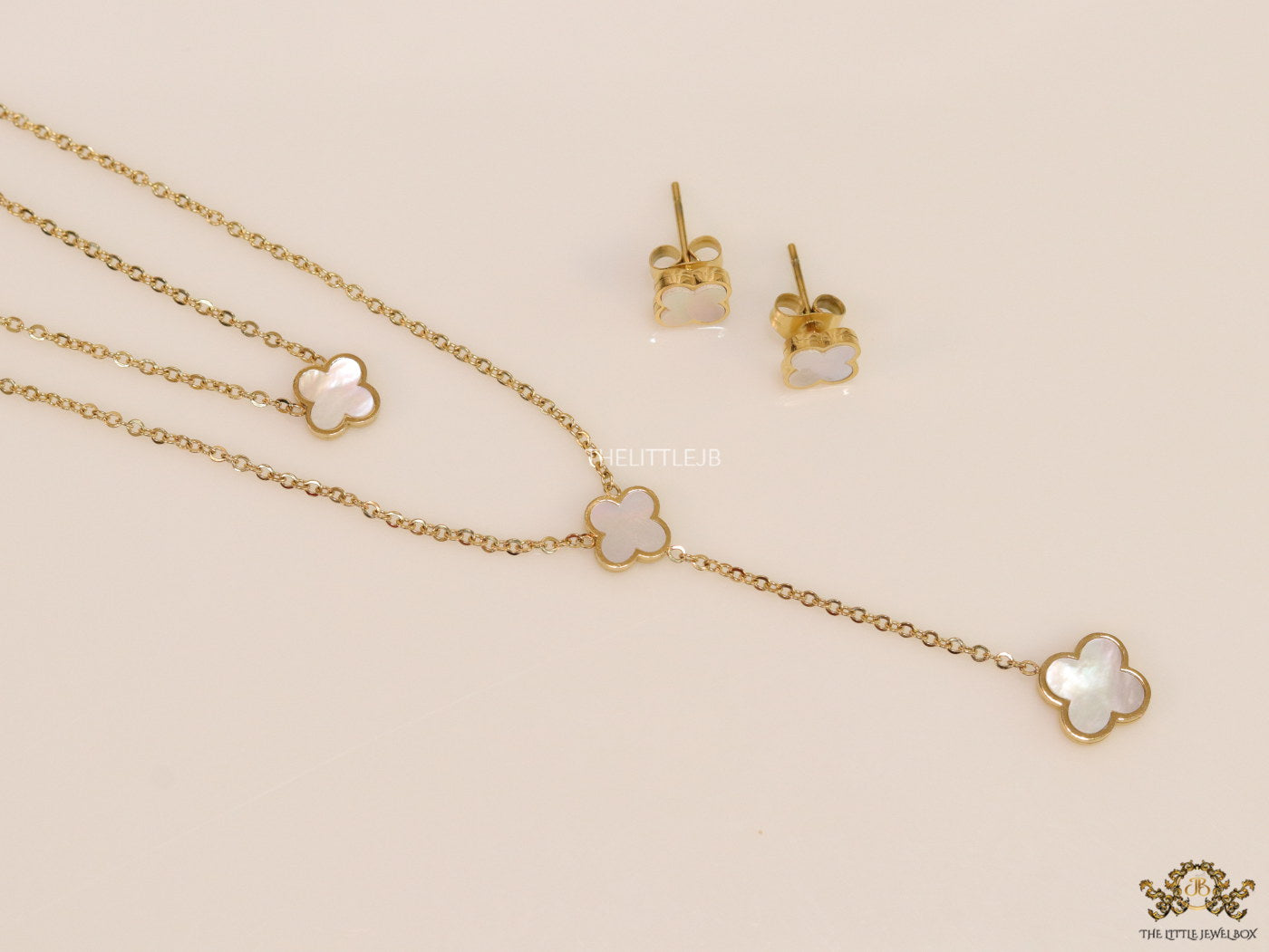 Dual chain necklace with white MOP clover in gold finish