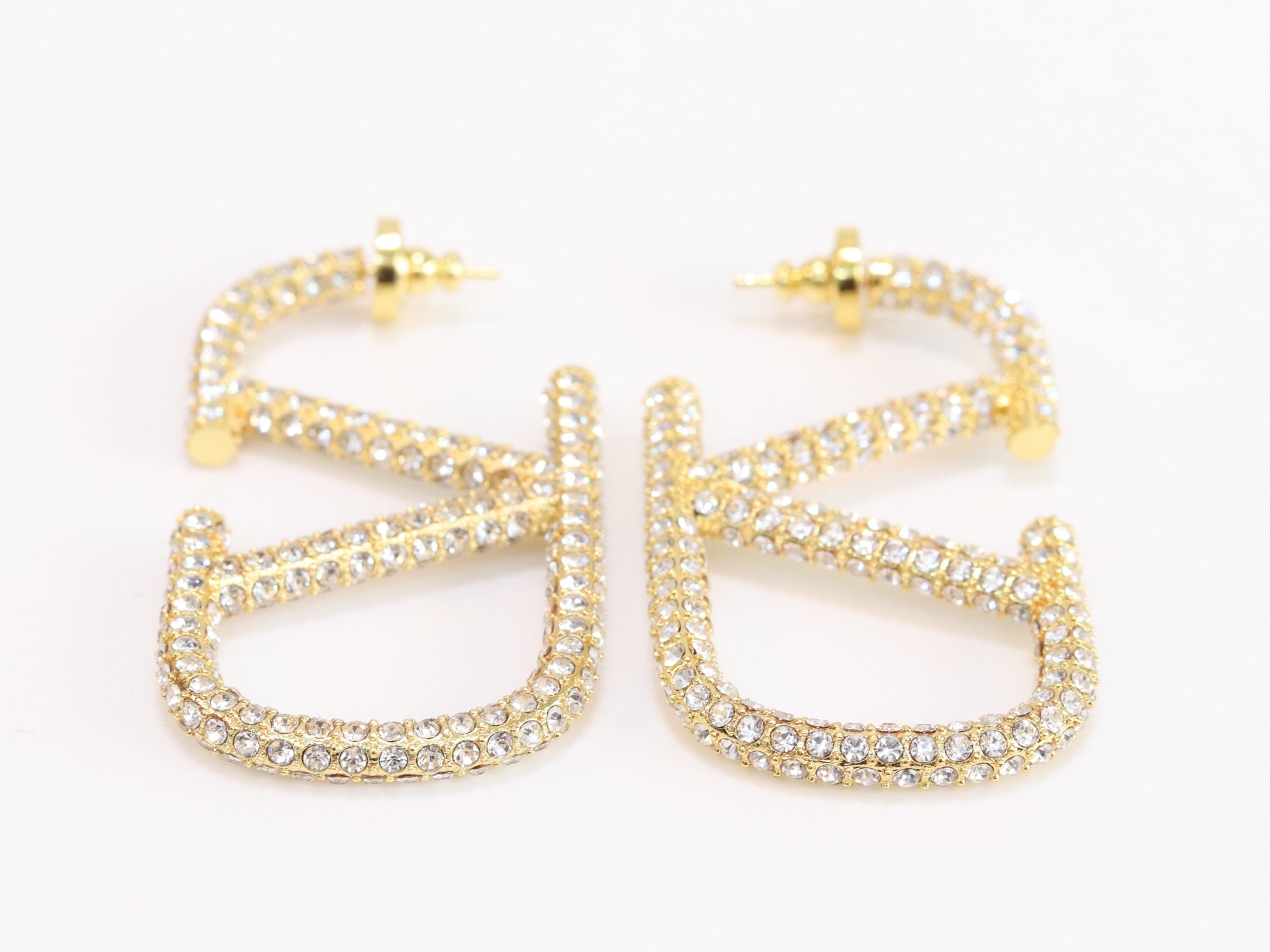 Open golden alphabet V earrings with cz 62 mm
