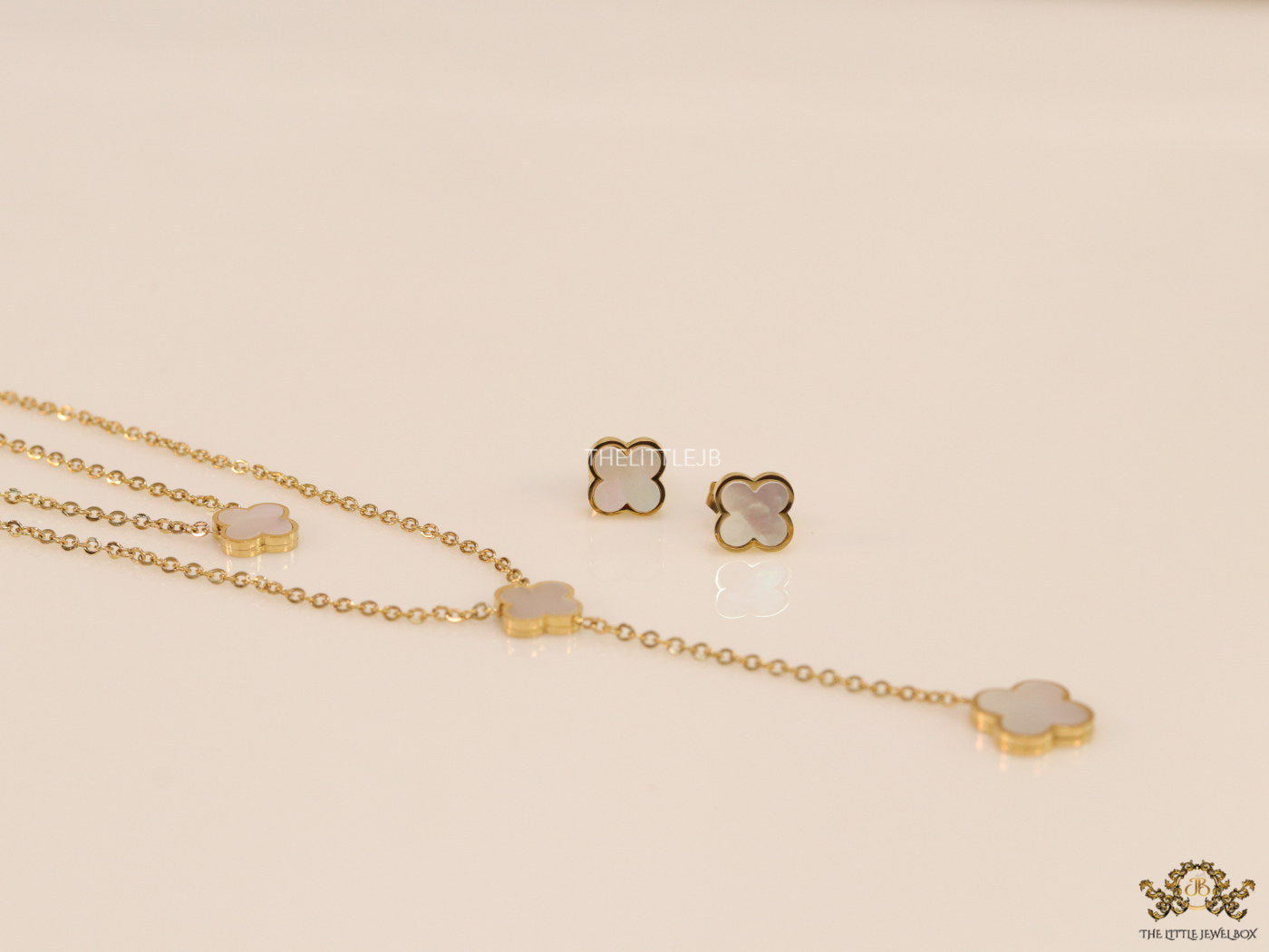 Dual chain necklace with white MOP clover in gold finish