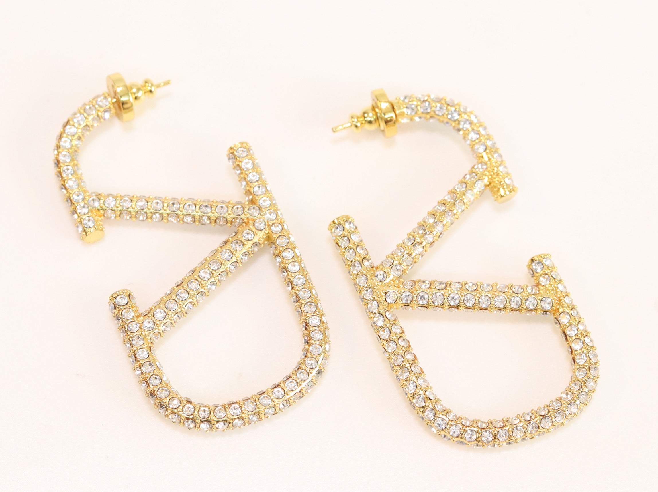 Open golden alphabet V earrings with cz 62 mm