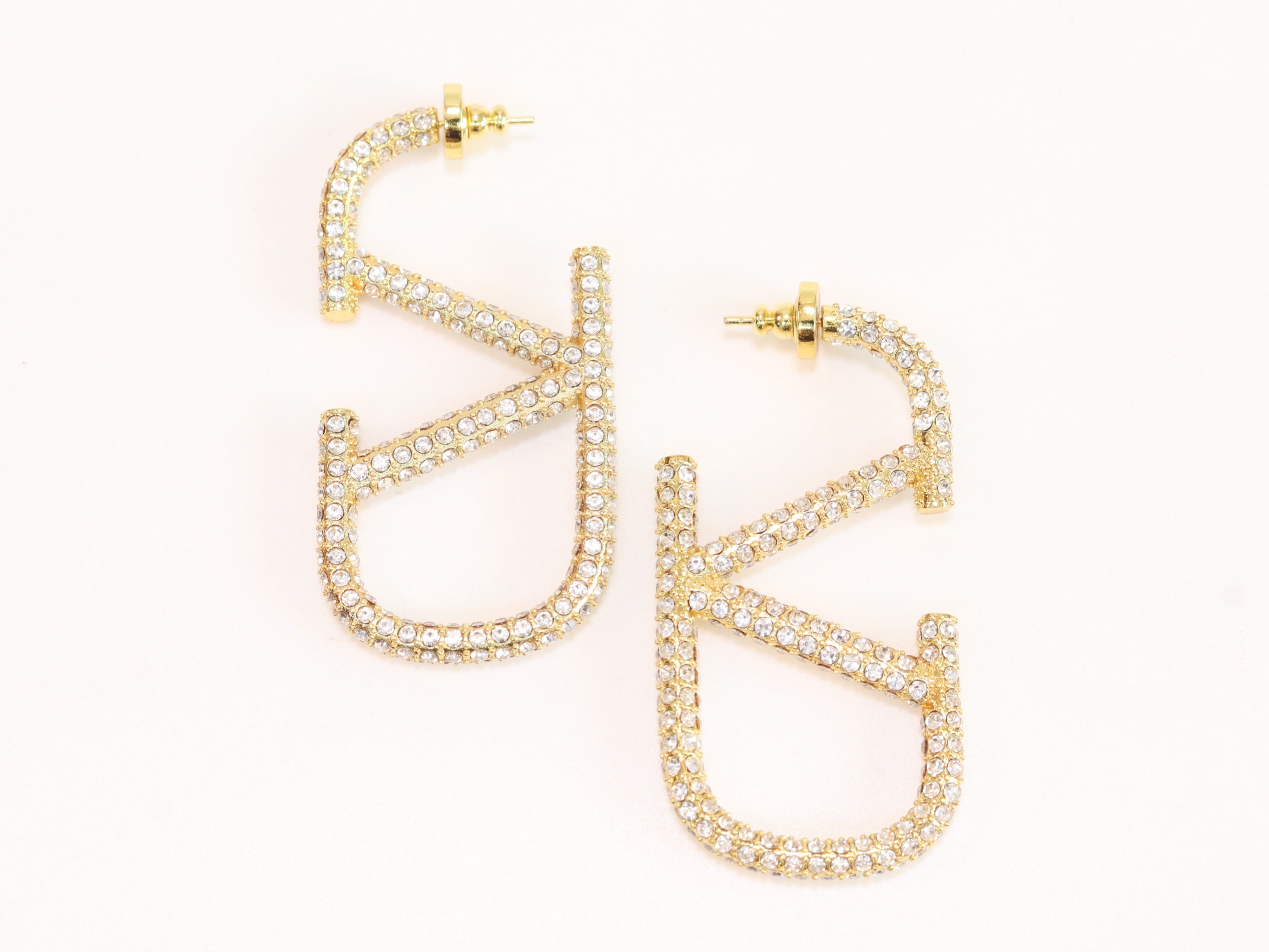 Open golden alphabet V earrings with cz 62 mm