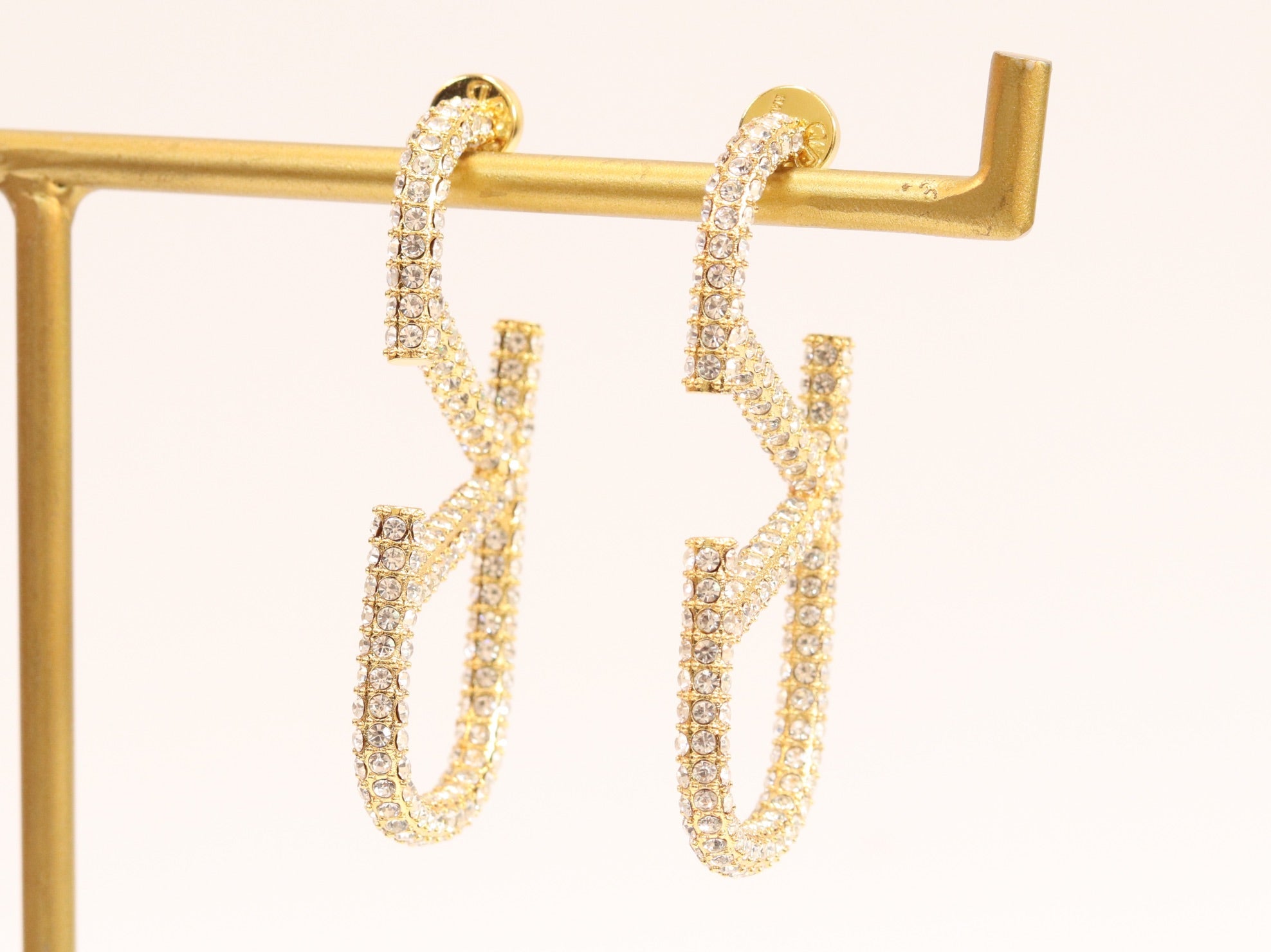 Open golden alphabet V earrings with cz 62 mm