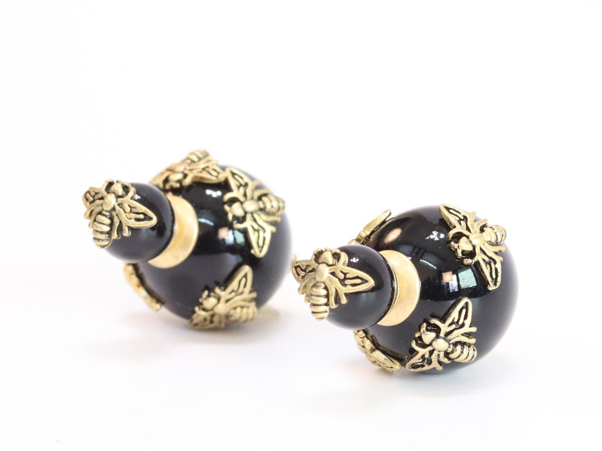 Rustic dragonfly on black pearls in gold