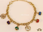 Gold plated link chain bracelet with multi enamel and MOP charms