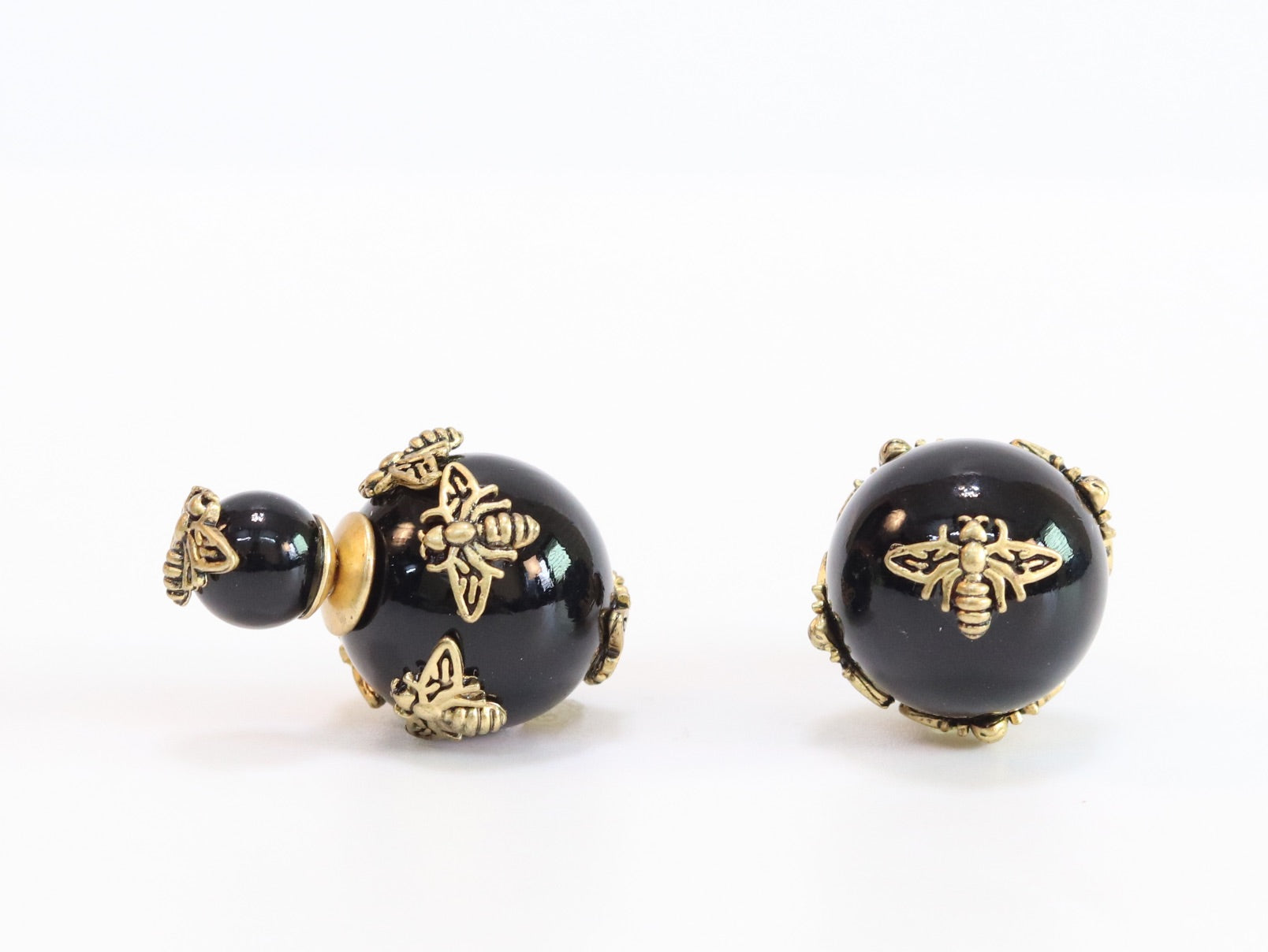 Rustic dragonfly on black pearls in gold