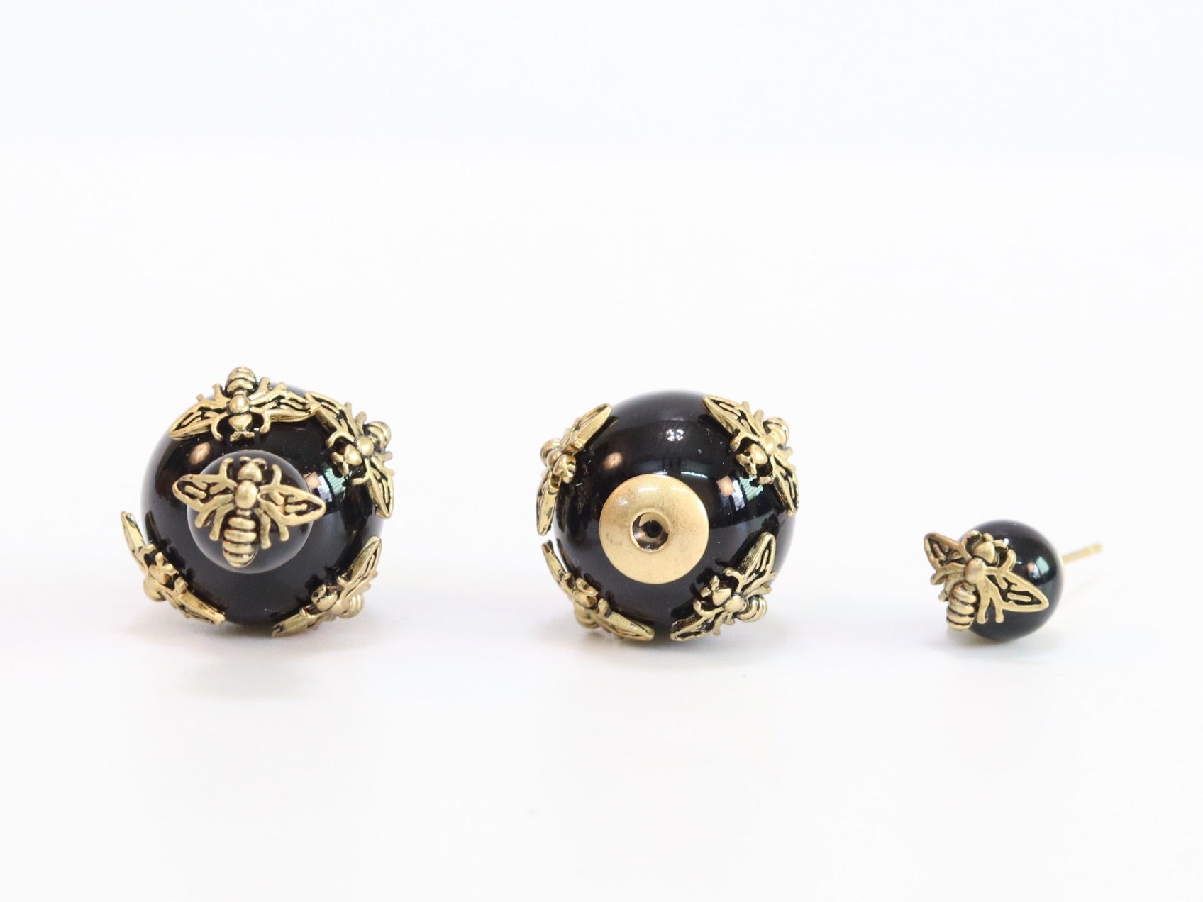 Rustic dragonfly on black pearls in gold
