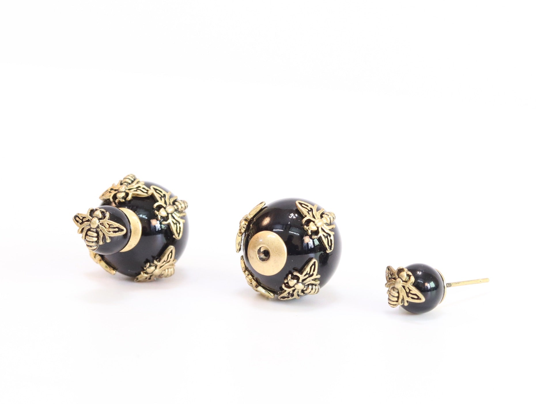 Rustic dragonfly on black pearls in gold