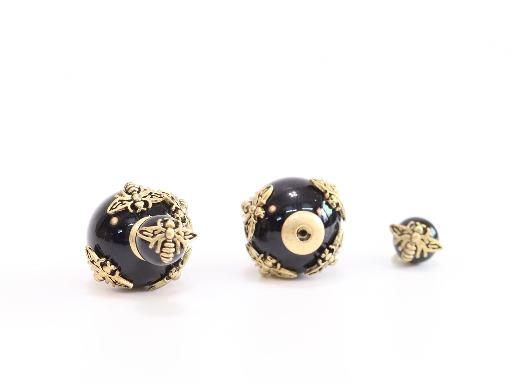 Rustic dragonfly on black pearls in gold