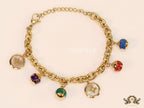 Gold plated link chain bracelet with multi enamel and MOP charms