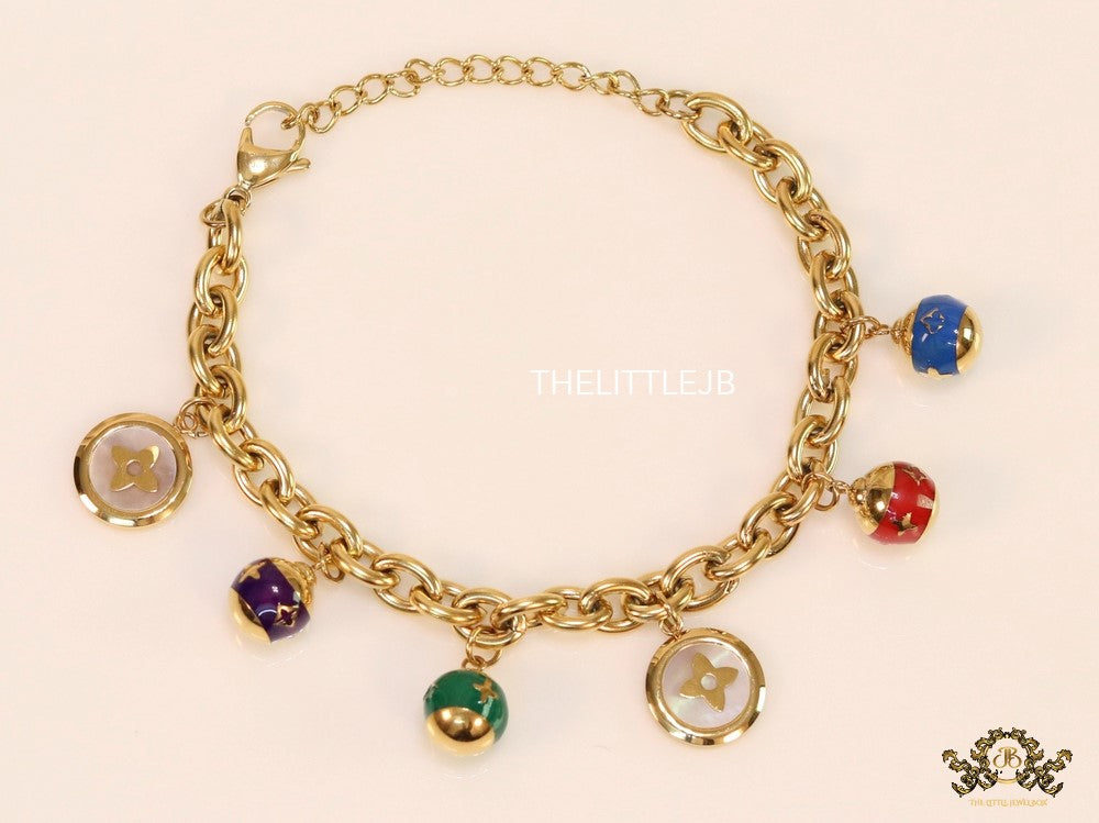 Gold plated link chain bracelet with multi enamel and MOP charms