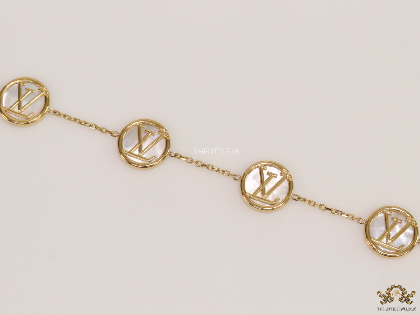 Gold plated sleek chain bracelet with MOP discs