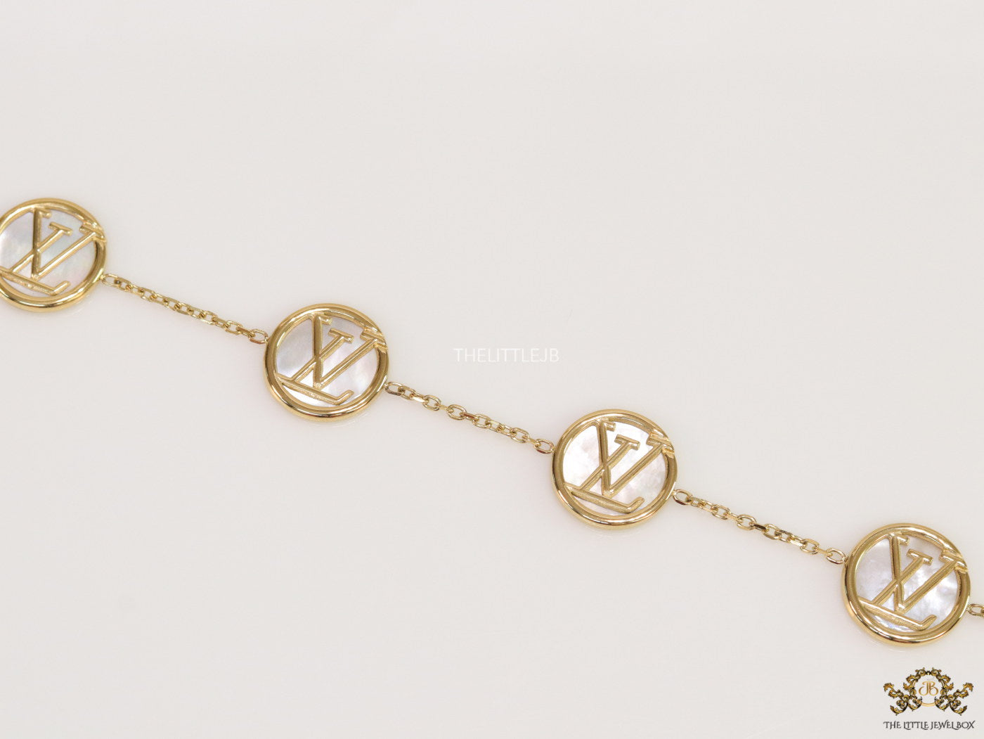 Gold plated sleek chain bracelet with MOP discs