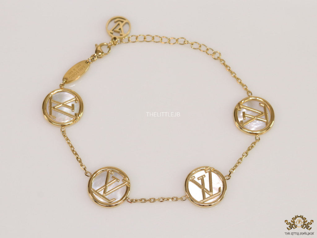 Gold plated sleek chain bracelet with MOP discs