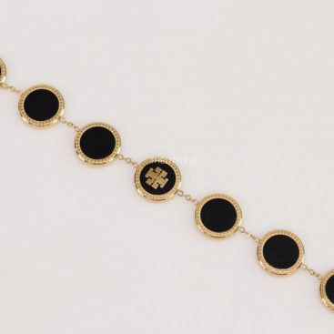 Gold plated chain bracelet with T motif on black enamel coating