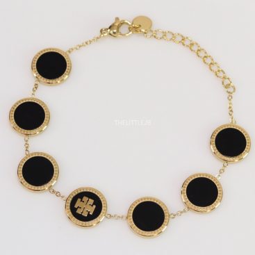 Gold plated chain bracelet with T motif on black enamel coating
