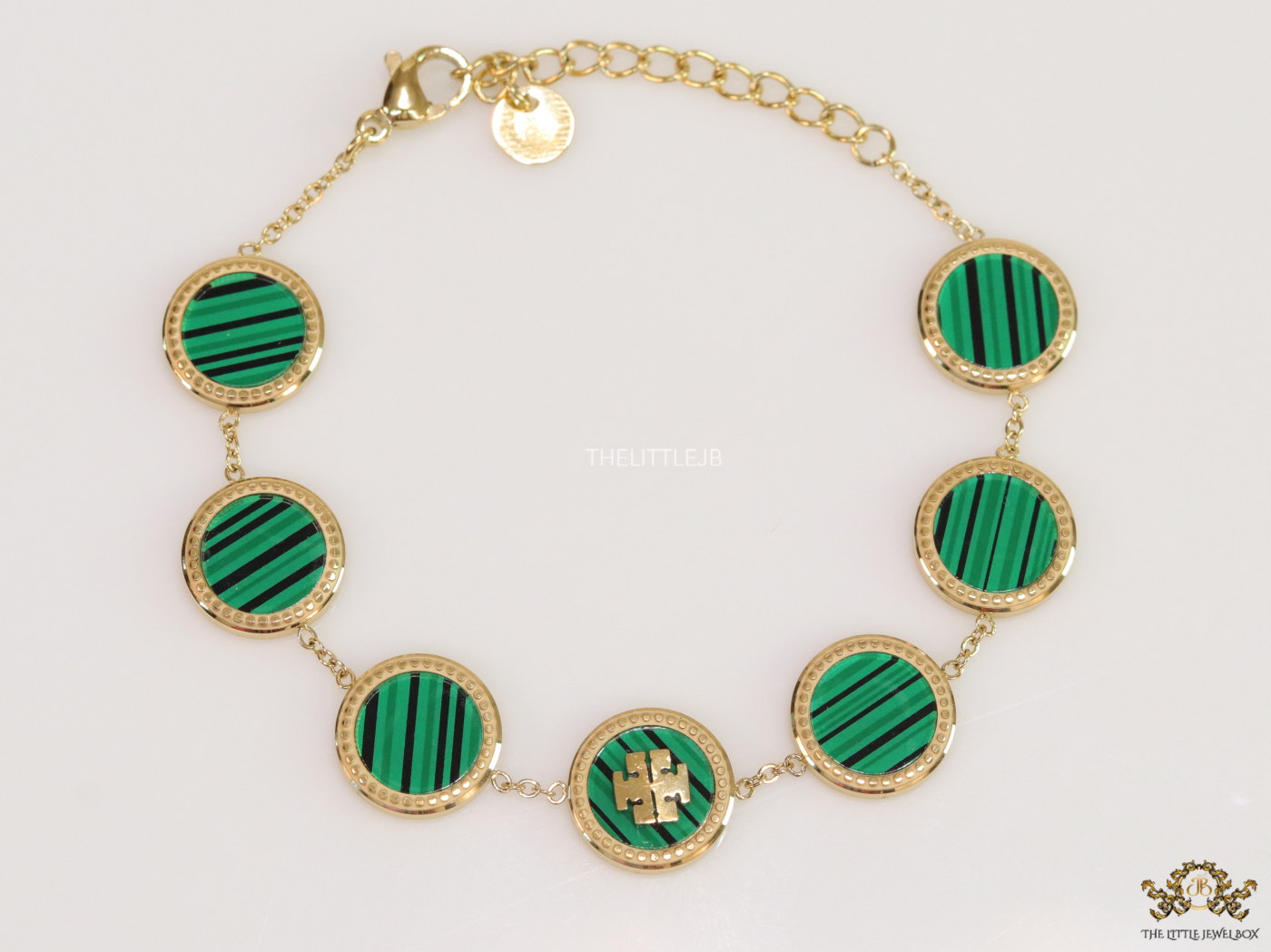 Gold plated chain bracelet with T motif on malachite green discs