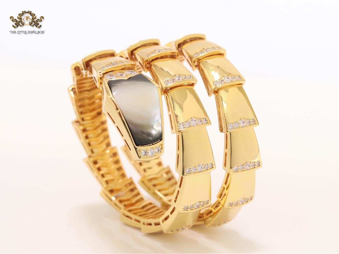 Bold gold and cz serpenti bracelet with black mop head