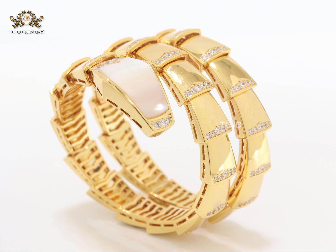 Bold gold and cz snake bracelet with mop head