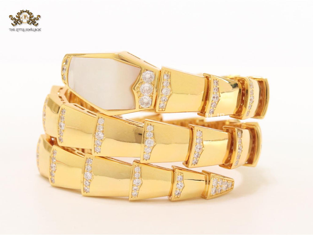Bold gold and cz snake bracelet with mop head