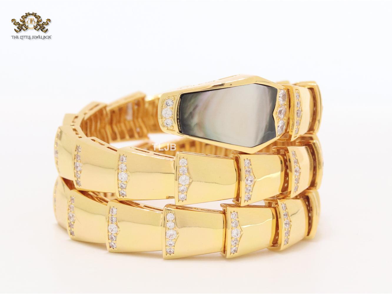 Bold gold and cz snake bracelet with black mop head