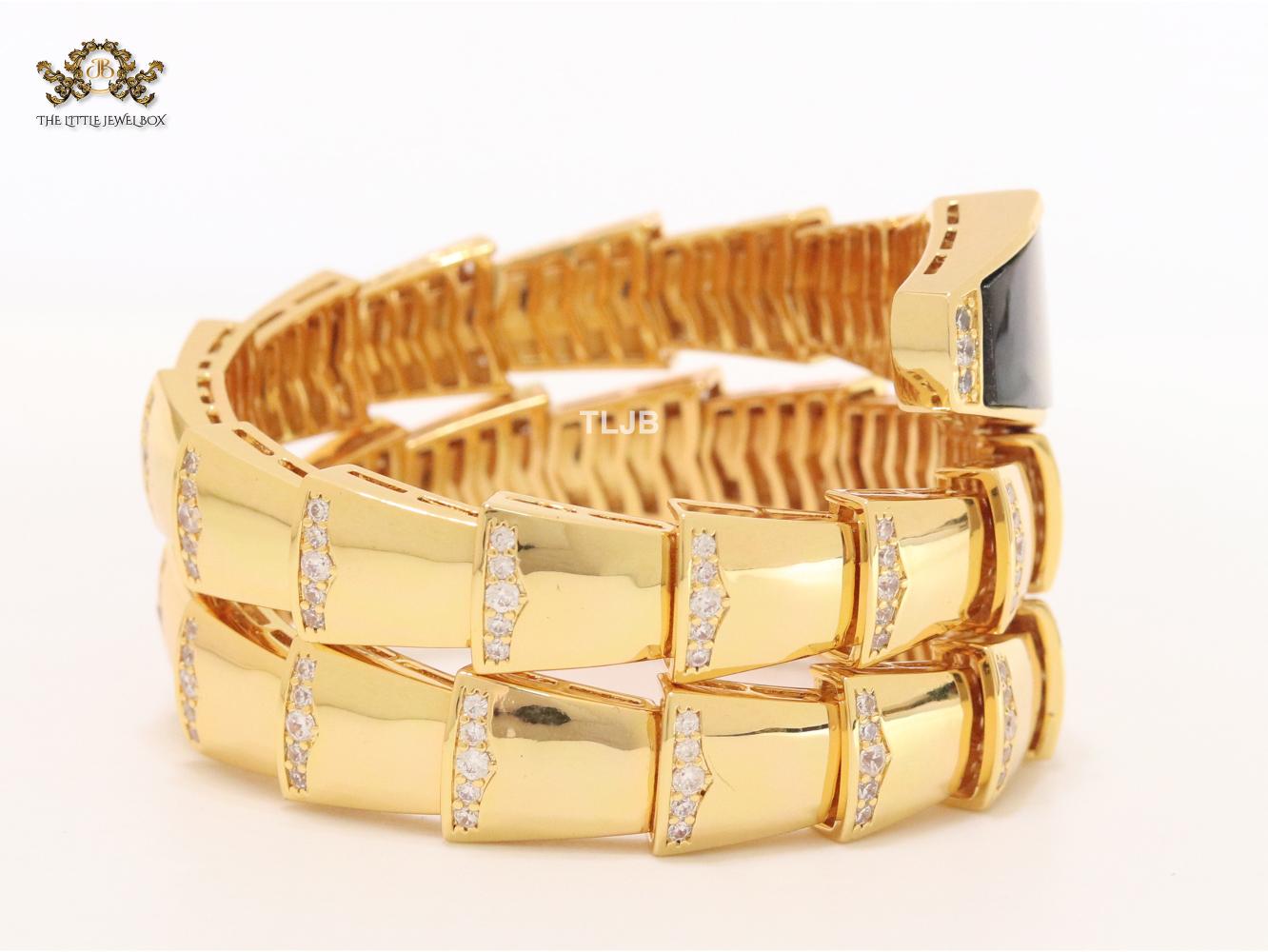 Bold gold and cz snake bracelet with black mop head