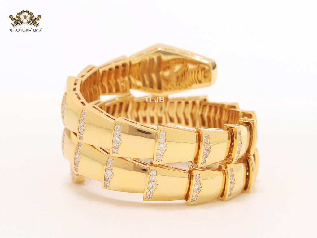 Bold gold and cz snake bracelet with black mop head