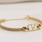 Gold plated watch strap bracelet with V motif