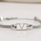 Platinum plated watch strap bracelet with V motif