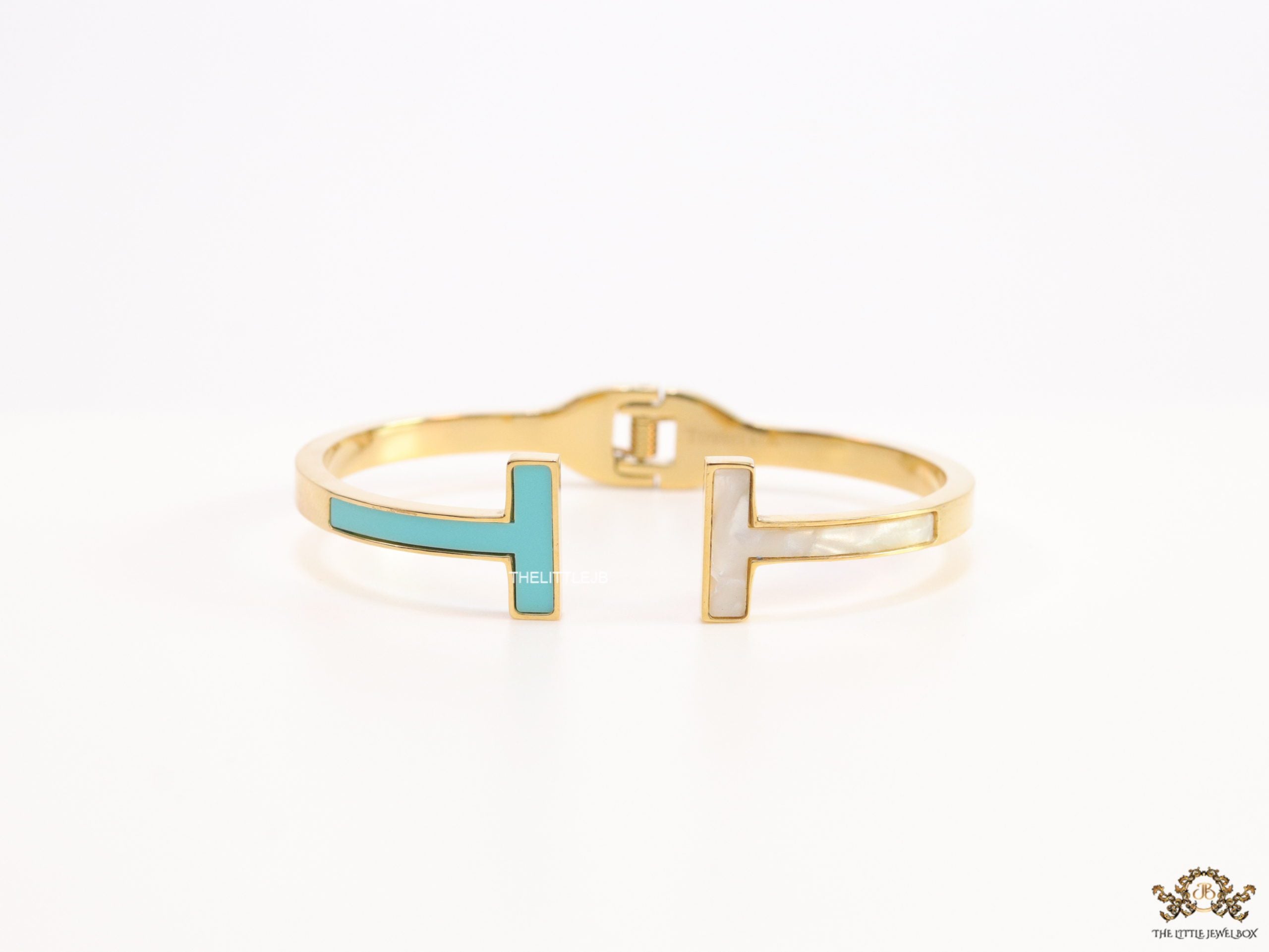 Gold plated open bracelet with blue enamel and MOP ends