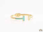 Gold plated open bracelet with blue enamel and MOP ends