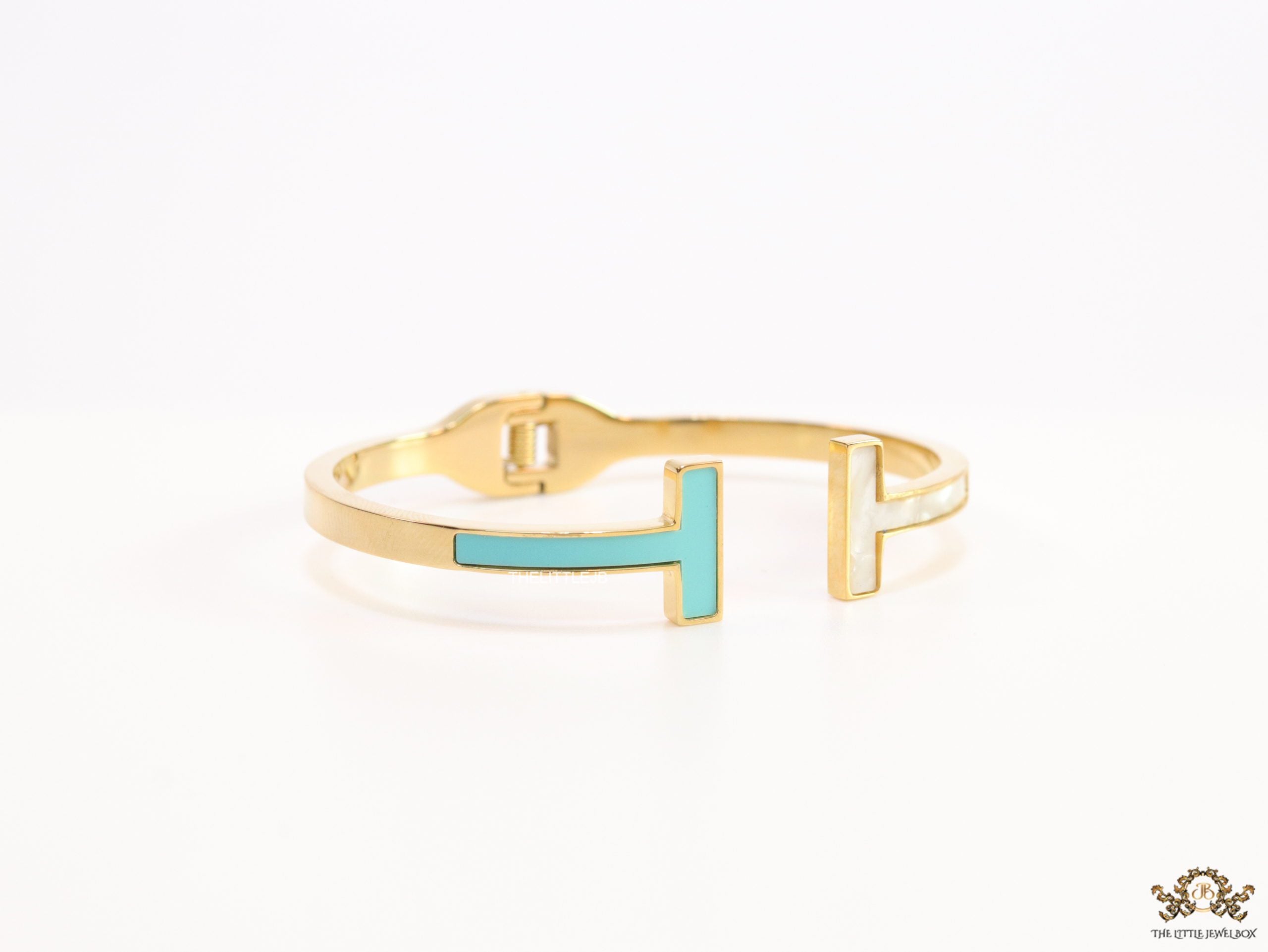 Gold plated open bracelet with blue enamel and MOP ends
