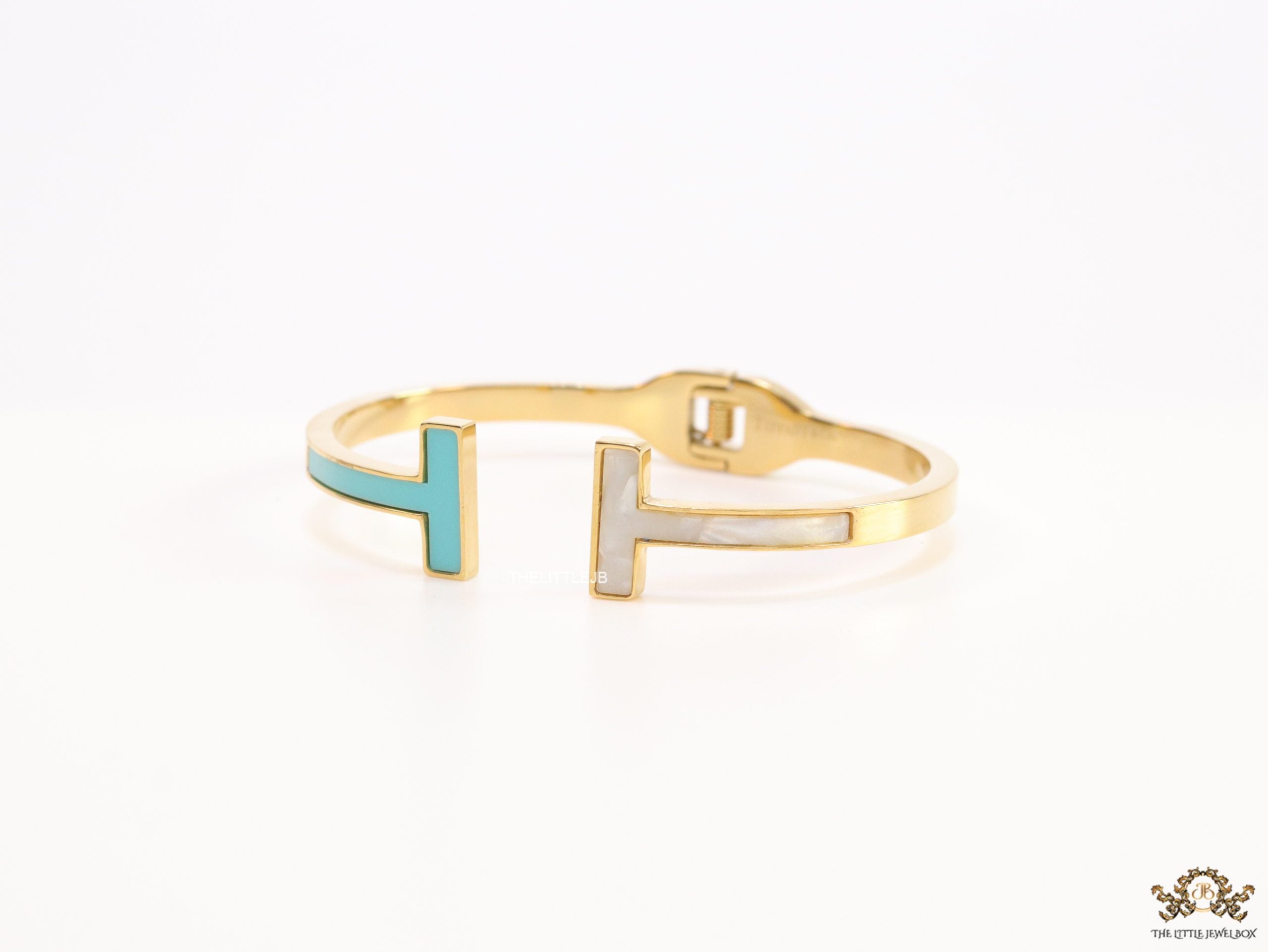Gold plated open bracelet with blue enamel and MOP ends