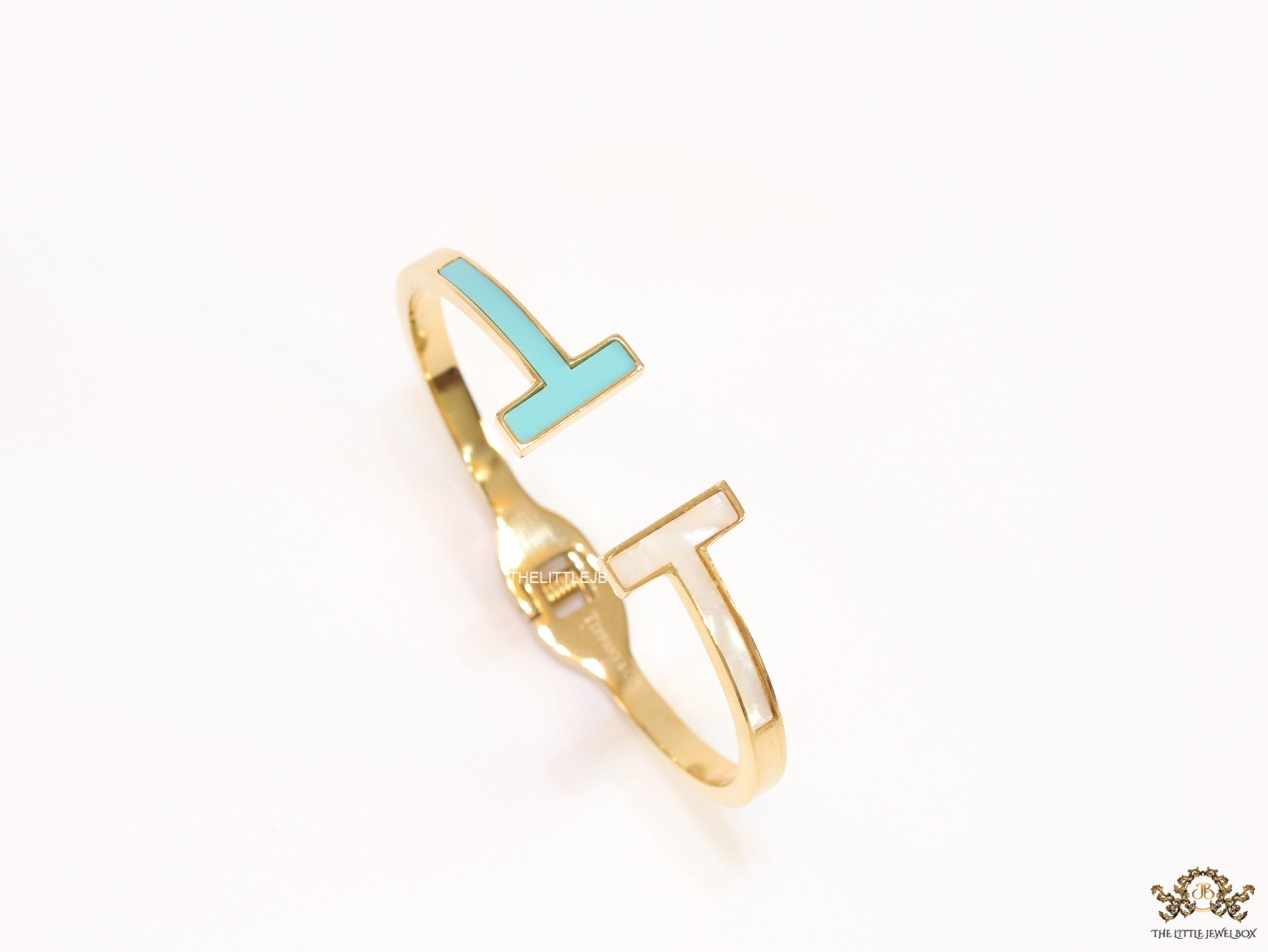 Gold plated open bracelet with blue enamel and MOP ends